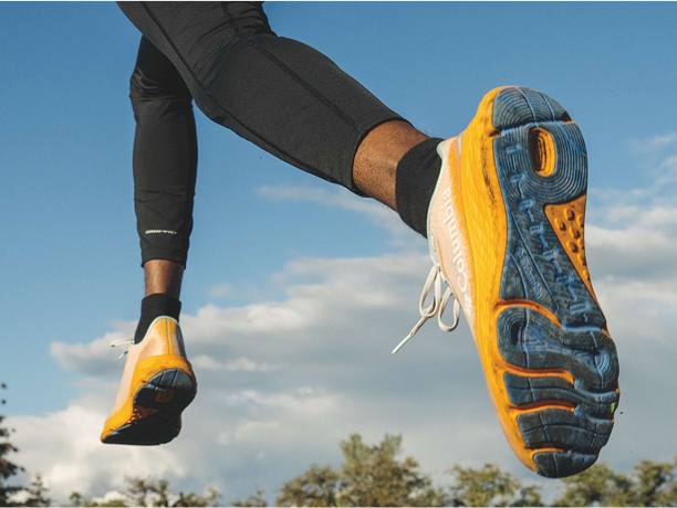 Two young men wearing Vineyard Vines clothing playing lacrosse