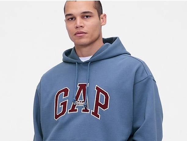 Two students wearing Polo clothing studying a book